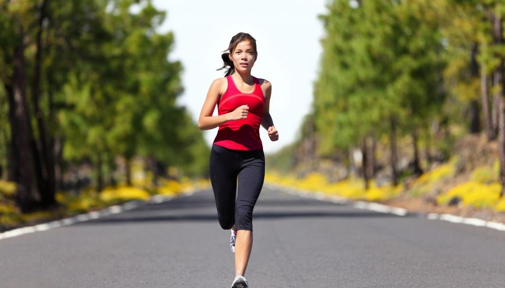 Sport fitness running woman jogging during outdoor workout. Beau